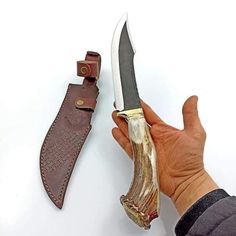 Beautiful crown stag handled knife, blade made of D2 steel. It's heavy duty knife to add in your survival gears. It's perfect knife for all outdoor activities, beautiful piece to add in your knife collections. We do accept custom order's feel to ask for your custom knife. All our knives are handmade, so it can be bit different from photos shown in listings.  Dimensions: Blade: D2 steel Handle: Crown Stag Antler Sheath: Cowhide leather sheath Overall length: 13 inches Blade length: 8 inches Handle length: 5 inches Blade thickness: 4mm  ADD ONS: Complimentary full-grain cowhide leather sheath Keen and precise re-sharpening prior to shipping Personalization available Easy to retrieve. Every knife has its unique pattern on the blade, it is handmade so it can be a little bit different from the Men Christmas Gift, Luxury Gifts For Men, Deer Horn, Gift Luxury, D2 Steel, Hunting Gifts, Knife Collection, Mens Anniversary Gifts, Custom Knife