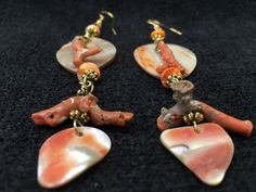 "Artist: Teresa Bradford ~ Red Abalone, Spiny Oyster shell, Red Coral gold-filled ear wire Length 4 1/2\" width 1\" One of a kind art to wear ~ Although a shell, not a stone, Abalone is widely used in jewelry and is a natural substance it does have metaphysical properties. It has long been believed that its many shimmering colors affect all the chakras of the human body, bringing them into balance and alignment. It is especially good for the heart chakra, gently cleansing fear, sorrow, and any d Red Shell Jewelry For Gifts, Red Shell Jewelry As A Gift, Red Shell Jewelry For Gift, Red Teardrop Jewelry For The Beach, Handmade Red Coral Jewelry For The Beach, Statement Piece Jewelry, Pacific Grove, Coral And Gold, Beaded Handbag