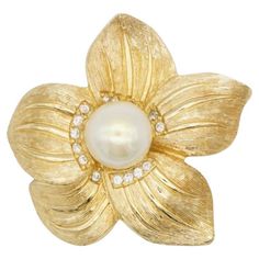 Christian Dior 1980s Vintage Wavy Flower White Circle Pearl Crystals Elegant Brooch, Gold Tone Very excellent condition and very new. 100% Genuine. A unique piece. This is gold plated stylised brooch. Safety-catch pin closure. Size: 4.0 cm x 4.0 cm. Weight: 17.0 g. _ _ _ Great for everyday wear. Come with velvet pouch and beautiful package. Makes the perfect gift for Teens, Sisters, Friends, Girlfriends, Birthdays, Anniversaries, Mother’s Day, Valentine’s Day, Christmas and many more. With exquisite fine detail, these fashion jewellery are ideal for a glamorous look. Ideal for a splendid gift or an eye-catching jewellery for your everyday outfit. Also don't forget to look through my other listings, I have so many more beautiful jewellery waiting for you. _ _ _ I am a freelancer more than 2 Luxury White Gold Oval Brooch, Luxury Vintage Brooch With Pearl Pendant, Luxury White Gold Brooches For Women, Luxury White Gold Elegant Brooches, Luxury White Gold Oval Brooches, Luxury Oval White Gold Brooch, Luxury White Gold Evening Brooches, Luxury Statement White Brooches, Luxury White Statement Brooches