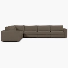 a large sectional couch sitting on top of a white floor