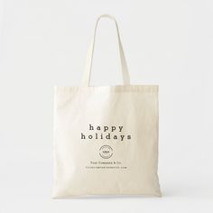 a tote bag with the words happy holidays printed on it, sitting against a white background