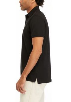 This classic-fit polo shirt from Tommy Hilfiger is an easy everyday choice. | Tommy Hilfiger Men's Classic Fit Polo Shirt, Black, Large Classic Black Tommy Hilfiger Top, Fitted Tommy Hilfiger Casual Polo Shirt, Casual Fitted Tommy Hilfiger Polo Shirt, Tommy Hilfiger Man, Tommy Hilfiger, Polo Shirt, Black