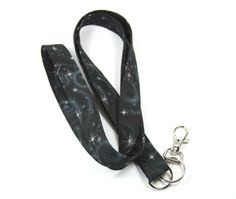 This cute lanyard has beautiful stars on black. It is perfect for any occasion. You can leave me a convoy if you need a different size. You can have a wardrobe of lanyard to match your outfit. This lanyard is made of soft 100% cotton fabric to give a comfortable feel around your neck. This lanyard is easy to take care. You can spot clean and throw in a washer and hang dry. If you want you can iron and it is ready to use. These lanyards are perfect if you have metal allergy. Each of these lanyard Black Lanyard With Key Leash For Personal Use, Adjustable Black Lanyards For Personal Use, Adjustable Black Badge Holder With Key Leash, Black Lanyard With Key Leash As Gift, Cute Lanyard, Beautiful Stars, Stars Fabric, Cute Lanyards, Star Badge