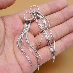 The price is for one pair. The tassel charm has 9 snake chains.  ---Metal Material: sterling silver ---Size: length 87mm, Ring Diameter 10mm ---Package: in a bubble emailer For more earring components, please find here: https://www.etsy.com/shop/SterlingSilverBox?section_id=26495108 We offer free shipping for orders more than USD 80 not including postages or taxes. Also, we provide 10% off for orders more than USD 250 not including postages or taxes. You don't need to apply any coupon. The system will calculate it when check out. Silver Dangle Threader Earrings, Silver Nickel-free Drop Tassel Earrings, Silver Dangle Threader Earrings For Party, Silver Tassel Single Earring As Gift, Silver Dangle Tassel Earrings For Pierced Ears, Silver Dangle Tassel Earrings, Silver Dangle Earrings With Tassels, Silver Metal Tassel Earrings Gift, Silver Tassel Earrings Gift