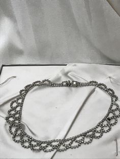 "1950's rhinestone costume jewelry. Bib style necklace in excellent vintage condition. All rhinestones are present on this piece. Lovely piece of costume jewelry for a wedding accessory. Measurements are; 16 1/2\" x 3/4\" Feel free to convo me with any further questions. Thank you for your interest." Sparkling Diamond Bridal Necklace For Evening, Metal Rhinestone Necklace For Anniversary, Round Rhinestone Metal Necklace For Wedding, Round Metal Rhinestone Necklace For Wedding, Formal Sparkling Rhinestone Metal Necklace, Round Rhinestone Necklace For Wedding, Glamorous Round Necklace For Evening, Glamorous Round Evening Necklace, Vintage Rhinestone Jewelry For Vintage Events