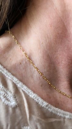 This delicate chain is a reflection of the Phoenicians (ancient Greek ancestors) symbol for life, rebirth and a drive to become godlike. The 19th letter of their alphabet. 18 carat gold over 925 sterling silver. 100% hypoallergenic. 15 inch chain and can extend to 17 inches. Ancestors Symbol, Classic 14k Gold Filled Chain Necklace Gift, Delicate Chain Oval Link Jewelry For Gifts, Delicate Oval Link Chain Jewelry Gift, Oval Link Jewelry With Delicate Chain For Gift, Gift Jewelry With Delicate Oval Link Chain, Classic 14k Gold Charm Necklace With Cable Chain, Gold Link Charm Necklace With Rolo Chain, Gold 14k Cable Chain Charm Necklaces