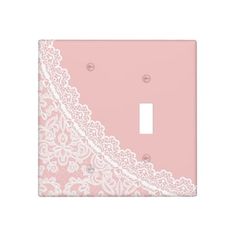 a light switch cover with lace on it