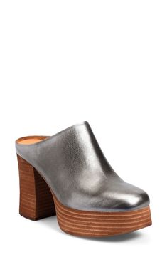 A stacked platform and chunky block heel elevate a rich leather mule set on a cushioned footbed for long-lasting wear. 4" heel; 1 1/2" platform(size 8.5) Cushioned footbed Leather upper/textile lining/rubber sole Imported Chic Platform Mules Medium Width, Chic Platform Mules, Chic Medium Width Platform Mules, Platform Mules With Block Heel In Medium Width, Modern Clogs With Padded Block Heel, Modern Clogs With Chunky Platform And Block Heel, Modern Platform Mules With Block Heel, Leather High Heel Mules With Chunky Platform, Formal Platform Clogs With Block Heel