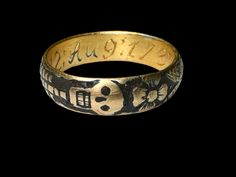 A Memento Mory gold and black enamel ring is also called a skeleton ring.Memento mori is a Latin phrase meaning 'remember you must die'. Finished in black enamel (niello) on the background, the skeleton is depicted around the whole surface of the ring and Fowler is behind the skull. An inscription on the inner band read: G. G.M.12:AUG:1737:AET 66: Circa 17th. Century Ad. Measurements: 18.2 mm., 5.19 grams. CONDITION Very good, with some light wear to the gold commensurate with age and use. Overa Symbolic Black Engraved Hallmarked Ring, Collectible Symbolic Black Skull Ring, Symbolic Black Engraved Ring For Anniversary, Memento Mori Jewelry, Memento Mori Ring, Skeleton Ring, Phrase Meaning, The Skeleton, Signet Rings