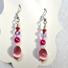 J76 Handmade Beaded Pink And Purple Dangle Earrings With Large Vintage Pink Beads Brand New Design! This Is A Listing For A Live Show. Please Watch The Live Show For More Information. Purple Dangle Beaded Earrings With Spacer Beads, Pink Dangle Beaded Earrings With Spacer Beads, Pink Beaded Czech Glass Earrings, Pink Beaded Drop Crystal Earrings, Pink Beaded Crystal Drop Earrings, Purple Crystal Earrings With Round Beads, Lavender Adjustable Dangle Beaded Earrings, Purple Faceted Bead Dangle Crystal Earrings, Purple Beaded Dangle Earrings