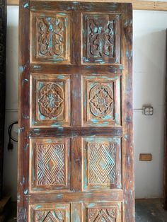 an old wooden door with intricate carvings on it