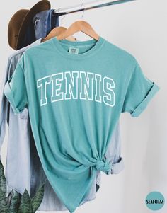 there is a tennis shirt hanging on a rack