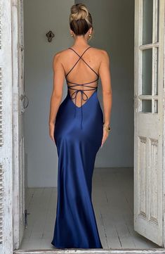 If you are looking for a super soft, romantic silhouette that skims over the body and enhances your figure, meet the Isobel maxi. Made from our silky soft satin with a bias cut, Isobel features a plunge neck, super low back with tie straps and a thigh high split. 



Colour: Navy.

Non stretch bias cut satin.

Thigh high split.

Plunge v-neck.

Hugs the figure.

Super low back with tie straps.

Maxi length.

Model is an XS and is wearing an XS.

 Size: XS, S, M, L, XL, XXL Navy Blue Backless Dress, Silk Navy Blue Dress, Navy Satin Prom Dress, Prom Dresses Navy, Homecoming Dresses Corset, Midi Dress Wedding Guest, Romantic Silhouette, Low Back Dress, Halter Top Dress