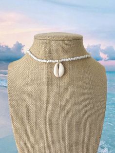 White seed bead necklace with sea shell charm necklace: 14” extender: 2.75” White Seed Bead Necklace, Diy Necklace Designs, Simple Choker Necklace, Staple Necklace, Shell Charm Necklace, Seed Bead Choker, Simple Choker, Gold Locket Necklace, Cross Choker