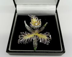 Love these fabulous and extravagant flower brooches in a classic Art Nouveau style. This is a particularly unusual  piece with the yellow and black enamel  small seed pearl. Delightful pinned on suit lapel or pretty frock. Measures 2 inches by 1.5 inches Pin and roll over clasp Lovely condition with all stones in place Boxes and bits are for the photographs only Please take a careful look at the photographs as they are an important part of my description and condition of the item If you would li Elegant Yellow Flower Brooches, Formal Flower Enamel Brooches, Formal Flower-shaped Enamel Brooches, Elegant Flower Enamel Pin Collectible, Unique Flower Brooches For Formal Occasions, Bijoux Art Nouveau, Vintage Choker Necklace, Jewellery Art, Wedding Bridesmaid Jewelry