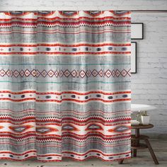 a shower curtain with an abstract design in grey, red and orange colors on it