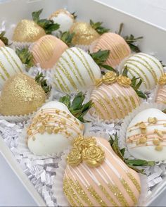 chocolate covered strawberries in a white box with gold decorations