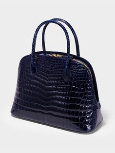 KRIS TALLEN's design, which combines classicism and post-modernism, aims for chic and produces crocodile bags that do not follow trends but add luxury through sturdy and sophisticated production that can be passed down from generation to generation. - Lightweight crocodile leather used- Practical design with three different structures- Can be worn in three ways: tote, shoulder or cross- Detachable strap for various styles High-end Travel Bags With Crocodile Pattern, High-end Top Handle Bag With Crocodile Pattern, Luxury Rectangular Satchel With Crocodile Pattern, High-end Crocodile Pattern Travel Bags, Luxury Structured Shoulder Bag For Formal Occasions, Luxury Crocodile Pattern Tote Satchel, Luxury Formal Satchel With Crocodile Pattern, Luxury Satchel With Crocodile Pattern Tote, Luxury Structured Bags