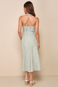 Looking absolutely darling is what the Lulus Daytime Sweetie Green Gingham Embroidered Halter Midi Dress is all about! Lightweight woven fabric boasts a green and white plaid pattern and delicate floral eyelet embroidery throughout as it shapes a sleeveless, sweetheart bodice with seamed cups and slender straps that create a tying halter neckline. The figure-skimming silhouette falls to an A-line midi skirt that features godet details that create a subtle flaring effect. A smocked panel at the b Spring Plaid Midi Dress Knee-length, Gingham Dress With Smocked Back For Garden Party, Green Casual Dress For Picnic, Casual Green Dress For Picnic, Green Midi Dress For Spring Picnic, Chic Smocked Bodice Dress For Picnic, Gingham Dress With Smocked Bodice For Garden Party, Summer Plaid Dress With Smocked Bodice, Chic Dresses With Smocked Bodice For Picnic