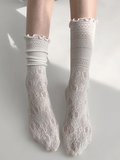 Elevate your outfit with these charming floral pattern lace socks. Available in classic black or white, these delicate socks add a touch of elegance to any look. The intricate floral design makes these socks a perfect choice for adding a hint of femininity to your ensemble.   Please note that this product includes one pair of socks only. Lace Socks Outfit, Lacy Socks, Trippy Clothes, Socks Lace, Steampunk Fashion Female, Frilly Socks, Black Floral Pattern, Steampunk Fashion Male, Gothic Skirts