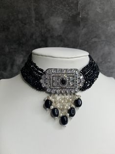 American diamond choker set. Victorian black polish with crystal beads. Pendent is about one hand half inch wide. Matching earring is about 2 inch long. Formal Beaded Dangle Jewelry, Elegant Jeweled Metal Choker, Jeweled Pendant Jewelry For Evening, Dangle Stone Jewelry For Party, Party Jewelry With Dangle Stones, Elegant Black Jeweled Necklaces, Silver Dangle Jewelry With Black Beads, Silver Beaded Choker For Evening, Black Party Jewelry With Bling