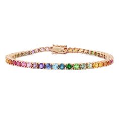 Get lost in a kaleidoscope of color with this rainbow tennis bracelet. An assortment of vibrant 3.0mm stones sit in four prong settings along the slim 14K gold backing, making this a dreamy 6.78Ct tennis bracelet. Gold Band Bracelet, Gold Sunset, Tennis Jewelry, Pretty Jewelry Necklaces, Bracelet Tennis, Rainbow Gemstones, Gems Bracelet, Rainbow Jewelry, Rainbow Bracelet