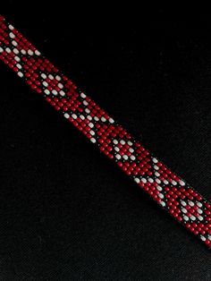 Necklace of red  colour with pattern (red and black colors) 100% Handmade  quality beads Bead length - 28cm/11.02in + chain Wedth - 1.4cm/0.55in The necklace has ties with which it will fit beautifully on any neck. If you need to change the length of the necklace - write a message. I will adjust the length to your size for free! How to care for your jewelry🌸 To ensure that your jewelry will serve you for a long time, here are some recommendations for its care😉: - do not wash in water💦 - keep away from sunlight🌞 - it is not advisable to apply products that contain active chemical components🫧 do not drop or hit the jewelry, because beads are fragile material🤍✨  Make your order with inspiration, SolNeck Gift Red Handwoven Beaded Necklaces, Bohemian Red Necklace With Black Beads, Traditional Red Necklaces With Black Beads, Traditional Red Necklace With Black Beads, Southwestern Style Red Necklace For Gift, Red Beaded Bracelets For Festival With Tiny Beads, Artisan Red Beaded Necklace With Black Beads, Red Bohemian Bracelet Beads, Handmade Red Beaded Choker Necklace