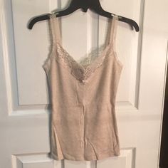 Cotton Camisole From The Express Never Worn And Still Has Tags On It V-Neck With Lace Straps And Neckline Length From Top Of Strap To Bottom: 24 Inches Width From Arm Pit To Arm Pit: 13 Inches Beige V-neck Camisole With Built-in Bra, Cotton V-neck Tank Top With Built-in Bra, Spring V-neck Stretch Camisole, Stretch Cotton V-neck Camisole, Elegant Stretch Cami Vest, Casual V-neck Camisole With Lace Trim, Beige Stretch Camisole Tank Top, Beige Stretch V-neck Tank Top, Beige Fitted V-neck Camisole