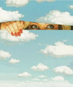 a woman's face is peeking out from behind a long piece of paper with clouds in the background