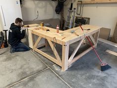 a man working on a table in a garage