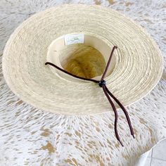 Hand woven fine palm hat. Brim measures 4”. Available in S/M or L/XL. 100% natural palm fiber is grown in warm coastal areas of Mexico and as a sustainable fiber is environmentally friendly. SPF 50 rating by California Polytechnic State University. Material: Hand woven palm sewn with double lock stickers. variations in color our weave are natural. Each hat is unique. Packing: Palm is very pliable and can be packed in a suitcase with articles of clothing stuffed in and around the crown. Re-Shapin Adjustable Flat Crown Toquilla Straw Hat, Adjustable Coastal Straw Hat Made Of Toquilla, Handwoven Natural Straw Hat For Rodeo, Natural Handwoven Straw Hat For Rodeo, Handwoven Toquilla Straw Hat For Rodeo, Handwoven Natural Hat Band With Flat Brim, Country Style Sun Hat With Flat Crown For Beach, Natural Toquilla Straw Boater Hat, Brown Flat Crown Sun Hat For Beach