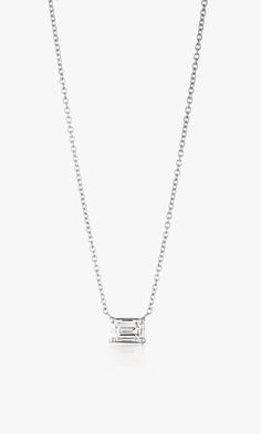 Elegant and enchanting, this emerald cut diamond necklace embodies timeless sophistication. Set in lustrous 14K white gold and a 4-prong setting, the E/F color and VS clarity of this sustainable, lab-grown, .51 carat diamond exude a pristine brilliance. A symbol of refined luxury and enduring glamour that's perfect for layering to add a touch of sparkle to any ensemble. *Note: 7 day return for store credit only. No exchanges allowed. Product Details .51 Carat Emerald Cut Bezel Tennis 16.5" Neckl White Gold Pendant Necklace, Streetwear Chic, Emerald Cut Diamond, Note 7, Fine Jewelry Collection, Emerald Cut Diamonds, East West, Emerald Cut, Timeless Beauty