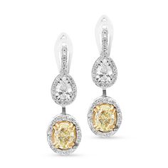 Take her breath away with these stunning diamond and fancy yellow diamond drop earrings that are sure to offer incomparable beauty and unmatched quality. Expertly crafted in 18K white and yellow gold, each eye-catching double-drop design features a shimmering canary yellow oval-shaped diamond in a yellow gold setting surrounded by a white diamond halo. Atop is a glistening pear-shaped brilliant-cut diamond in a pave-lined halo hanging from a diamond-adorned post. Radiant with Canary Yellow Diamonds, Yellow Diamond Earring, Fancy Yellow Diamond, Drop Design, Yellow Gold Setting, Canary Yellow, Diamond Drop Earrings, Diamond Drops, Fancy Color Diamonds