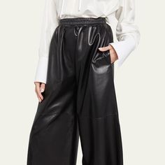 Loewe cropped wide-leg leather pants Side seam pockets; single back patch pocket High rise Elastic waist Loose fit Pull-on style Lambskin leather/viscose/polyester Dry clean Imported Elegant Leather Wide-leg Pants, Elegant Wide-leg Leather Bottoms, Luxury Wide Leg Bottoms For Fall, Elegant Wide-leg Leather Pants, Chic Wide-leg Leather Pants, Luxury Leather High-waisted Pants, Luxury Trousers For Fall, Chic Leather Wide-leg Pants, Modern Wide Leg Leather Pants