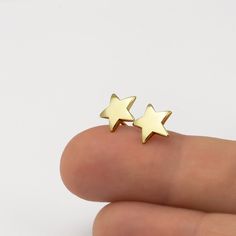 Minimalist gold star stud earrings, handmade of yellow 14k solid gold, with a highly shiny finish. These gold star studs are perfect for every occasion, great for any age. Chic and stylish, a wonderful gift for yourself or for someone you love. Star's hight is ~8.5 mm = ~0.33 inch Star's width is ~8.5 mm = ~0.33 inch 14k solid gold ear backs are included. * The earrings will be packed in a gift box ready to give as a gift, and shipped via Express mail service which usually takes 5-8 business day Minimalist Star-shaped Tarnish Resistant Earrings, Minimalist Yellow Gold Star Earrings, Dainty Yellow Gold Star Earrings, Minimalist 14k Gold Star Charm Earrings, Minimalist 14k Gold Earrings With Star Charm, Everyday Yellow Gold Star Earrings, Yellow Gold Star Earrings For Everyday, 14k Gold Star Earrings Gift, Everyday 14k Gold Star Earrings