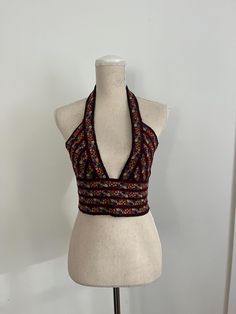 Women's Bralette Black with blue/orange flowers halter, deep v bralette Size small:  Bust: 35" bust (model wears 34B or 36A bra) Waist: 27.5" waist (26" long with extension for buttoning) Halter: 14" deep from shoulder to sternum Festival Halter Top With Built-in Bra, Bohemian Halter Top With Built-in Bra, Spring Festival V-neck Halter Top, Festival Bra Friendly Halter Neck Top, Festival Halter Neck Top, Bra Friendly, Festival-ready Bra-friendly Halter Neck Top, Fitted Multicolor V-neck Halter Top, Festival Halter Neck Crop Top, Bra Friendly, Floral Print Halter Neck Top For Party