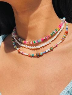 Our Gemstones Beaded Necklace is a radiant and cheerful piece designed to bring a touch of warmth and joy to your day.  These necklaces features an arrangement of mixed gemstone beads in a vibrant palette reminiscent of a sun-kissed summer day. Whether you want to add a pop of color to your everyday attire or make a statement at a special event, this necklace will effortlessly elevate your style. Necklace Sizes: From Top to bottom as seen modeled on default image All Colorful Gemstone: Pearl: 14 Bohemian Rainbow Jewelry With Letter Beads, Multicolor Heishi Beads Jewelry With Colorful Beads, Colorful Bohemian Jewelry With Letter Beads, Multicolor Letter Beads Jewelry, Multicolor Letter Beaded Jewelry, Colorful Bohemian Letter Beads Jewelry, Multicolor Heart Beads Round Jewelry, Colorful Festival Jewelry With Letter Beads, Multicolor Heart Shaped Beads Jewelry