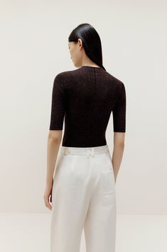 Don’t think twice, just toss this on for instant, effortless style! Our Half Sleeve Sweater is knit from irresistibly soft lightweight wool, making it the perfect top and layering piece. Details Materials & Care Shipping & Returns • Made from Merino wool – naturally warm and breathable with a glossy sheen.• A stylish fine-knit top featuring an elegant mock neck• Half sleeves hit right at the elbow for a super flattering cut.• Tailored for a streamlined fit for easy layering. Size M is 22.8" in l Half Sleeve Sweater, Merino Sweater, Lovely Tops, Classic Chic, Merino Wool Sweater, Work Attire, Sweater Sleeves, White Sweaters, Wool Sweater