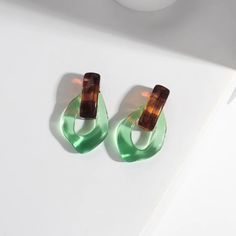 Trendy Green Drop Earrings, Green Resin Earrings For Summer, Retro Green Earrings For Party, Green Retro Party Earrings, Trendy Clear Drop Earrings, Trendy Clear Resin Jewelry, Green Plastic Summer Jewelry, Plastic Drop Earrings For Party, Chic Clear Earrings For Party