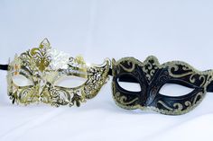 This is a stunning gold masquerade pair of masks that is perfect for a his and hers gold masquerade. For the girl's mask is a laser cut gorgeous gold mask we decorated with white gems and then for him is a resin black and gold mask to match hers! I hope you love these designs! In my shop I have a lot of different designs for couples masquerade mask in different colors and designs. If you wish to create you own couples masquerade mask please feel free to contact me anytime! I also have machine em Elegant Gold Mask For Masquerade, Gold Eye Masquerade Mask, Gold Venetian Masquerade Mask For Evening, Gold Mask For Mardi Gras Evening, Gold Masks For Mardi Gras Evening Events, Gold Masks For Mardi Gras Evening, Gold Carnival Masks For Evening, Gold Masks For Evening Carnival, Gold Venetian Eye Mask For Masquerade