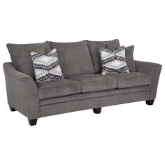 a gray couch with two pillows on it