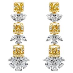 An elegant pair of drop earrings, showcasing six vibrant radiant cut fancy yellow diamonds weighing 6.43 carats total with VS clarity, set on a four prong 18K yellow gold setting. Accented by clusters of mixed-cut diamonds weighing 2.70 carats total with F color and VS clarity, set on platinum. Omega clasps are made with 18K yellow gold. Style available with matching pendant.  Roman Malakov is a custom house, specializing in creating anything you can imagine. If you would like to receive a special quote on a custom piece, please message or call us. Jeweled Picture, Colored Diamond Jewelry, Diamond Chandelier Earrings, Diamond Chandelier, Gold Basket, Diamond Solitaire Earrings, Fancy Jewellery Designs, Yellow Diamonds, High Jewellery