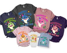 the baby shark shirts are all different colors