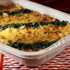 a casserole dish with spinach and cheese