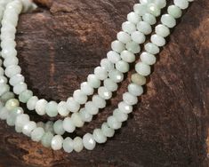 Classic and ever-popular jade in an easy-to-use cut and size! Add to dainty beaded bracelets, elegant earrings, and more. Prized in Asian cultures for thousands of years, Jades are actually found in many different regions of the world. Burma Jade beads can be pleasing hues including lighter tones of creamy white and light mint. They also come in darker shades of sage and can be as dark as dried tea leaves. Jade is actually a catch-all term for two seperate stones - jadeite and nephrite. Jades are formed in metamorphic rocks. They are composed of fine-grained crystal structures. The distinctive green color of jade is actually caused by impurities of chromium. Myanmar (Burma) is the top source of Jades, including this variety. Metaphysically, jades are said to evoke prosperity and good luck. Jade Faceted Beads For Jewelry Making, Faceted Jade Beads For Jewelry Making, Bracelets Elegant, Hand-strung Round Jade Bead Necklaces, Jade Beads For Jewelry Making, 8mm, Jade Natural Stones Round Beads, Crystal Structure, Hand-strung Green Jade Beads, Jade Gemstone Beads, Round Shape