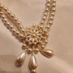 Beautiful fir a bride! Very old faux pearl necklace. Has extender chain and is double Strand. Looks New. No flaking ir discoloration. The center is reversable! How unique Victorian Pearl Chain Necklace For Formal Occasions, Antique Pearl Chain Necklace For Formal Occasions, Antique Pearl Chain Jewelry For Formal Occasions, Antique Formal Pearl Chain Necklace, Formal Antique Pearl Drop Necklace, Vintage Pearl Charm Jewelry For Anniversary, Vintage Jewelry With Pearl Charm For Anniversary, Victorian Pearl Drop Necklace For Formal Occasions, Vintage Pearl-embellished Jewelry For Formal Occasions