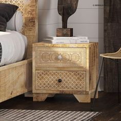 a bed with a wooden headboard and night stand