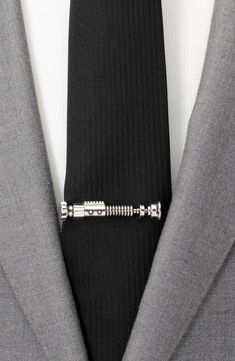 Use the Force to look supercool with this sweet Star Wars tie clip. 2" x 1/4" Metal Imported Groomsman Gifts From Bride, Starwars Groomsmen Proposal, Star Wars Wedding Details, Lightsaber Boutonniere, Star Wars Cufflinks, Star Wars Wedding Aesthetic, Star Wars Boutonniere, Star Wars Wedding Colors, Star Wars Inspired Wedding Dress