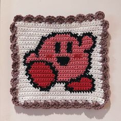 a crocheted square with a cartoon character on it