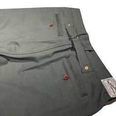 12oz USA 12oz Duck Canvas Gray CHINO Version There's a growing consensus that Heavy American fabrics may represent the best value in the Denim Market. Agree or not, this fabric is spot on in the American workwear category for longevity..The Duck Canvas we use has to be an America Classic. To us that means it is an America staple from the start and ages gracefully. This 12oz has a plain weave and is a very solid fabric. This fabric is the starting point for all American workwear. It is Sanforized Selvedge Cotton Bottoms For Work, American Workwear, Grey Chinos, Duck Canvas, The Duck, Aging Gracefully, All American, Plain Weave, Spot On